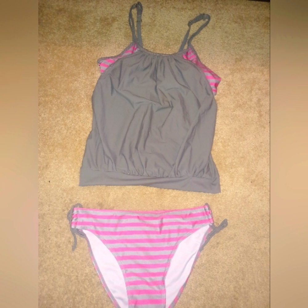 2 piece small pink and gray swimsuit that Provides coverage of your stomach.